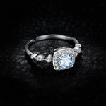 Classic-Halo-Blue-Topaz-Ring-black-background