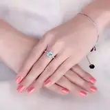 Classic-Halo-Blue-Topaz-Ring-display