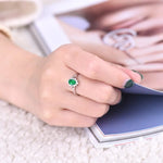 Oval-Floral-Halo-Emerald-Engagement-Ring-display